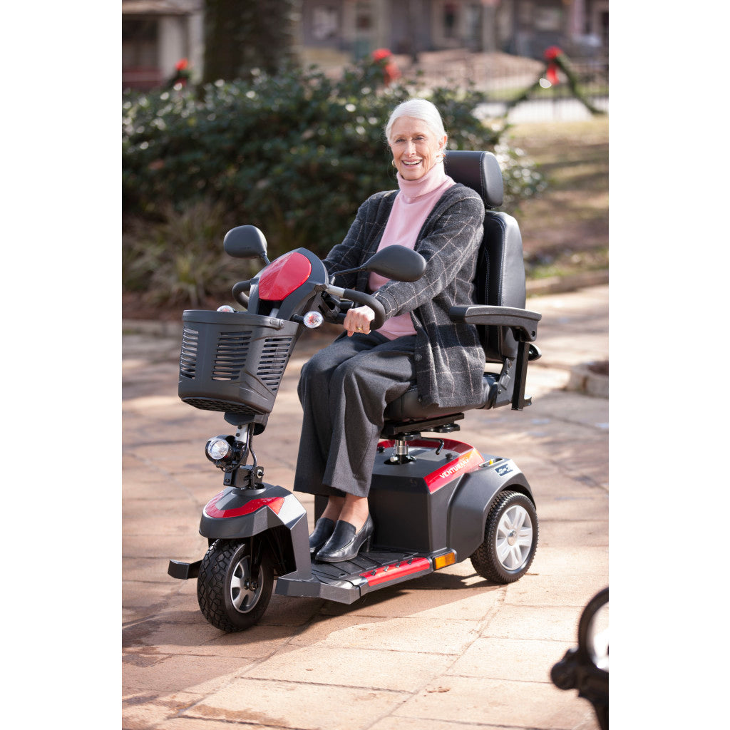 Woman riding Drive Medical Ventura 3-Wheel in Red