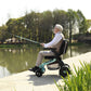 Man using a Golden Ally Power Wheelchair fishing by a lake