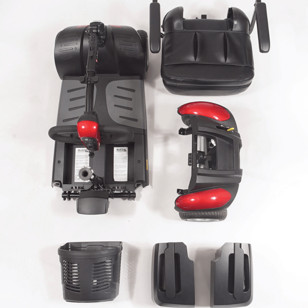 Buzzaround EX 4-Wheel Scooter mobility scooter in red with basket on a white background broken down