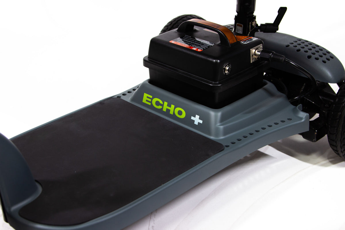 A Shoprider Echo+ mobility scooter in black color with a basket, solid tires, and a folding frame.