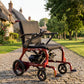 Monarch Mobility Flyer Power Wheelchair in Red on Sidwalk