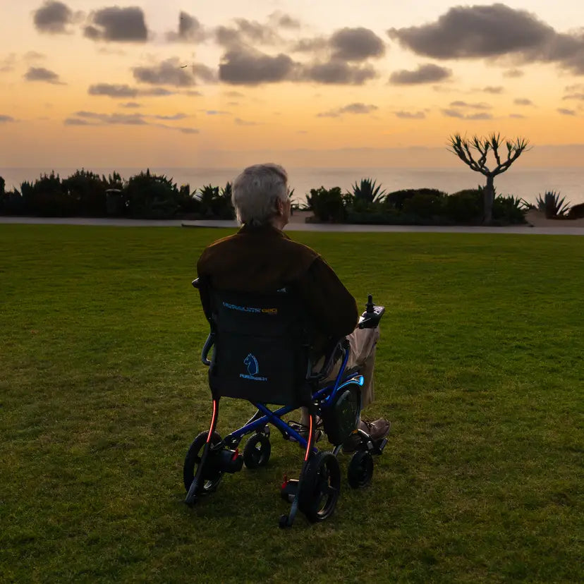 Man Watching Sunset from Forcemech Ultralite G20 Power Chair