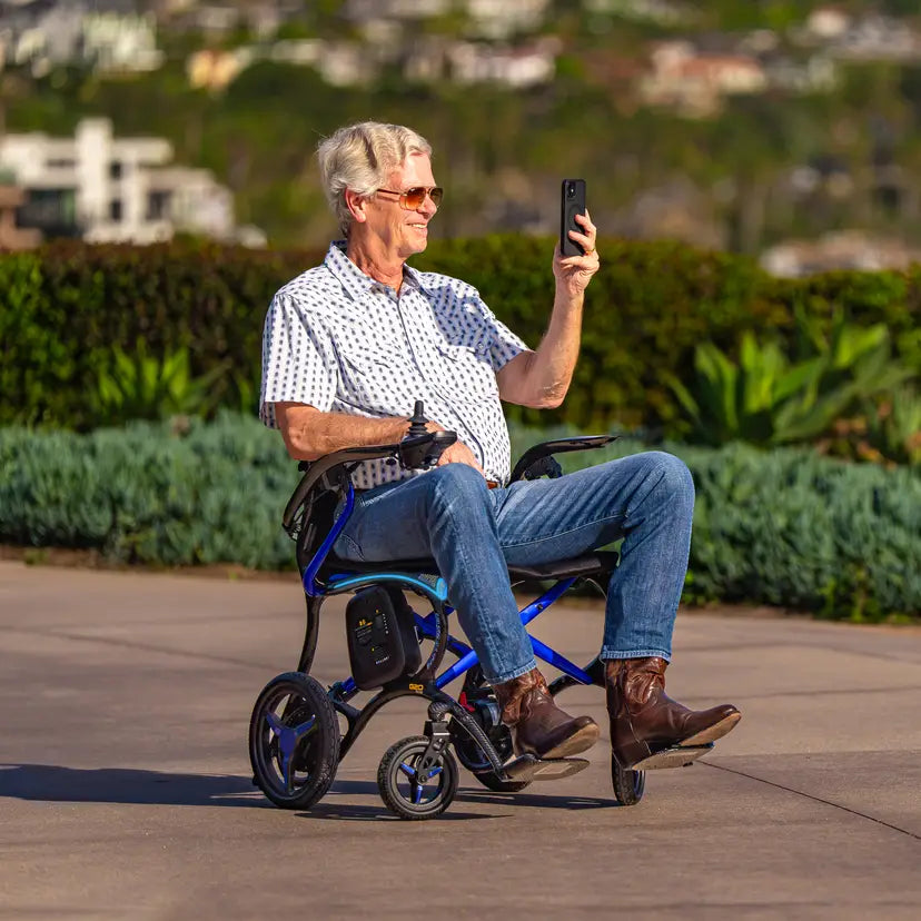 Man using phone in Forcemech Ultralite G20 Power Chair