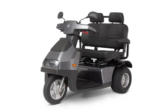 A grey Afikim Afiscooter S3 Dual Seat mobility scooter with three wheels and a dual seat configuration, designed for outdoor use.