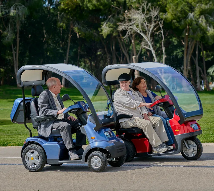 Seniors Riding Afikim Afiscooter S4 with Canopy