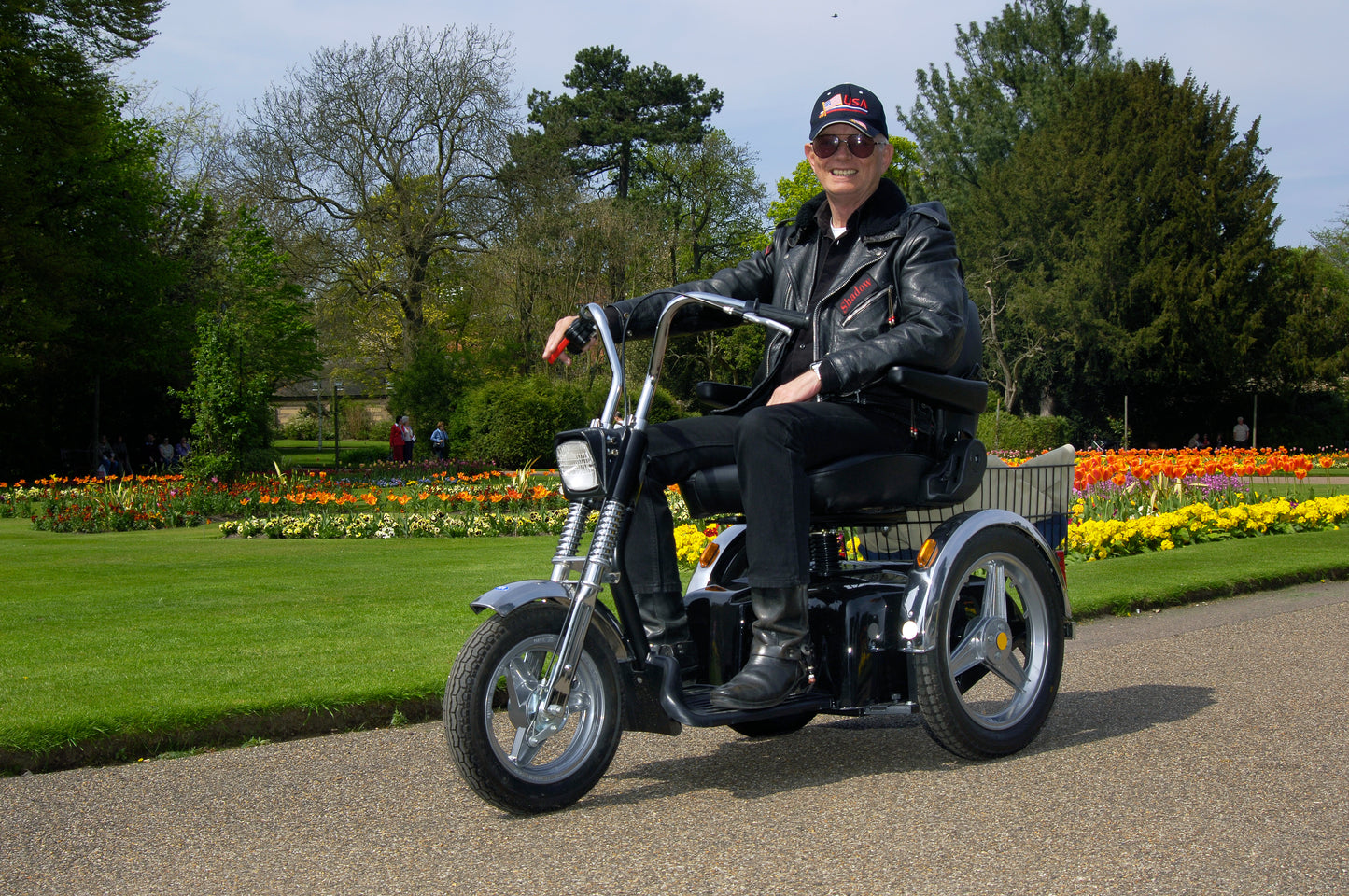 Senior Man Riding Afikim Afiscooter SE Three Wheel Recreational Mobility Scooter