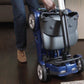 EV Rider Transport 4AF Automatic Folding Travel Mobility Scooter in Blue, folded, being towed.