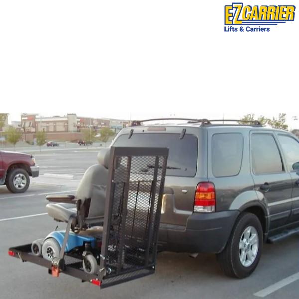 SUV with a wheelchair lift carrier attached on a road, featuring EZ Carrier branding.