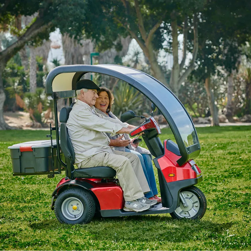 Seniors Ridding Afikim Afiscooter S3 with Canopy