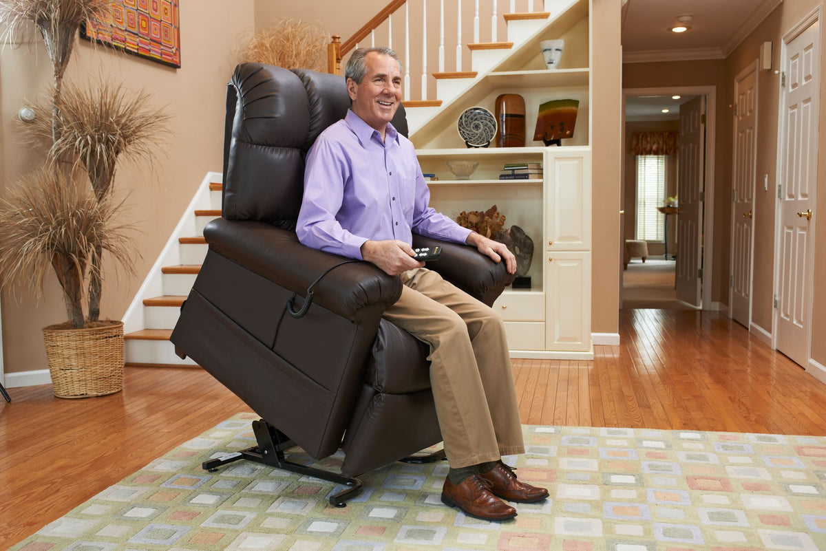 Man sitting in a Cloud PR510 Lift Chair Recliner with Maxicomfort by Golden Technologies in Blue